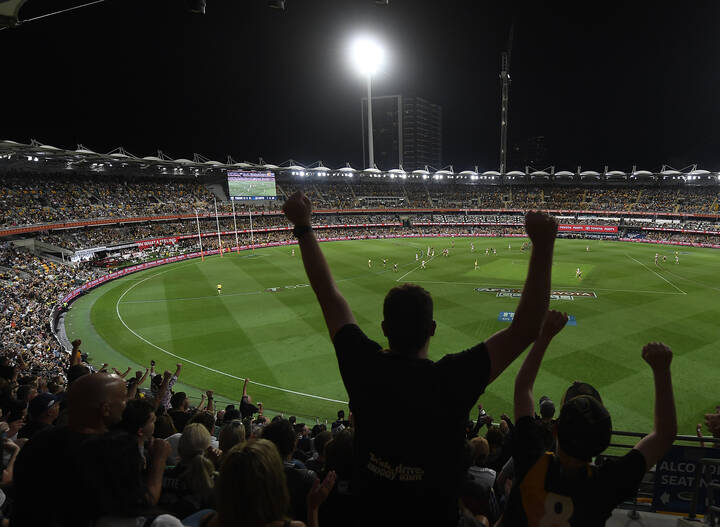 BRISBANE, AUSTRALIA - OCTOBER 24: Richmond fans celebrate at the end of the game during the 2020 AFL Grand Final match between the Richmond Tigers and the Geelong Cats at The Gabba on October 24, 2020 in Brisbane, Australia. (Photo by Ian Hitchcock/AFL Photos)